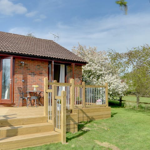 Eat alfresco on the sunny deck overlooking the fields beyond