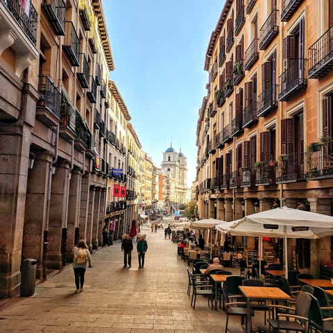 Visit bustling Plaza Mayor, a nine-minute walk away