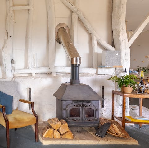 Warm your toes in front of the log burner in the lounge