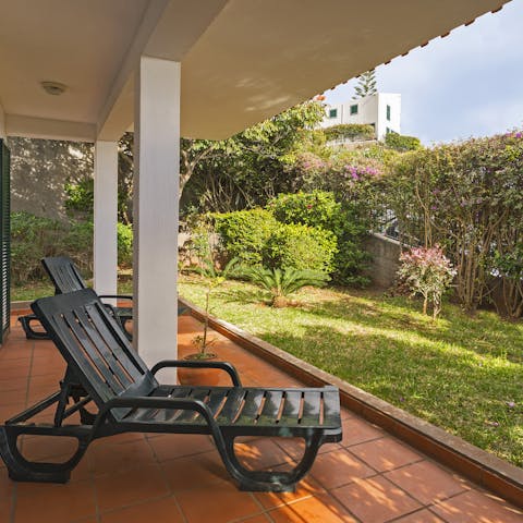 Relax in the lush garden with a glass of Madeira