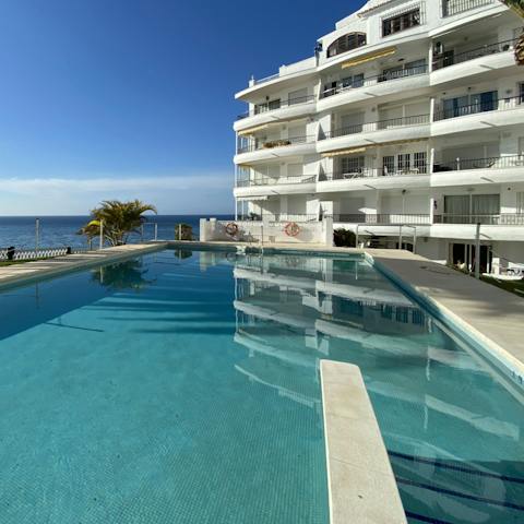 Jump into the shared swimming pool and make a splash under the clear blue skies