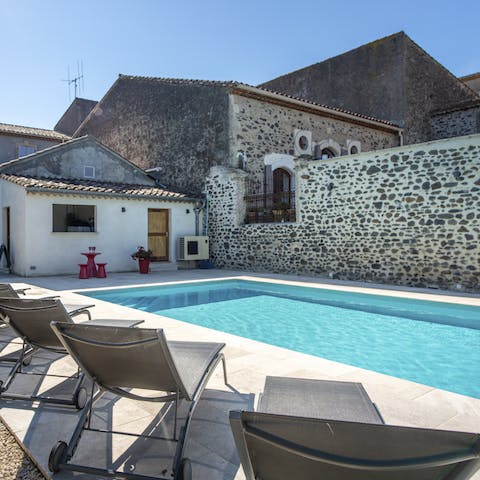 Soak up the sunshine by your private pool after playing pétanque in the garden