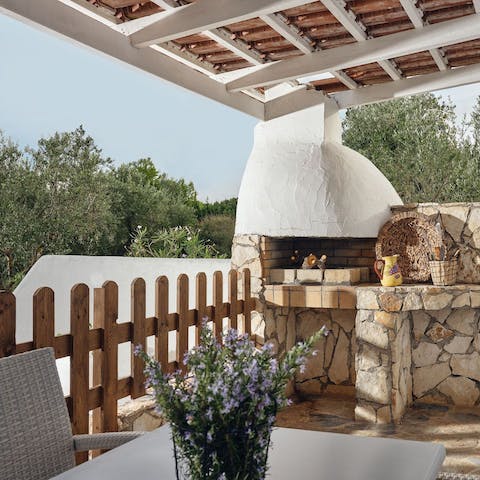 Fire up the barbecue for a grilled dinner on your natural stone terrace