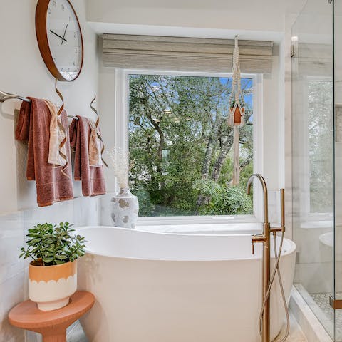 Unwind with a long soak in the dreamy standalone bathtub