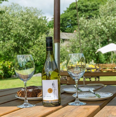 Put out a spread of wine and appetisers in the garden on sunny days