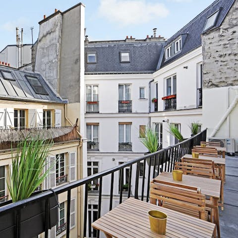 Relax on the rooftop terrace, nestled in Parisian architecture
