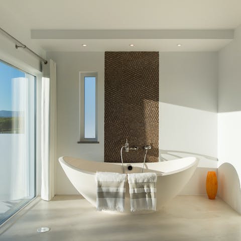 Sink into your freestanding bathtub for a rejuvenating soak