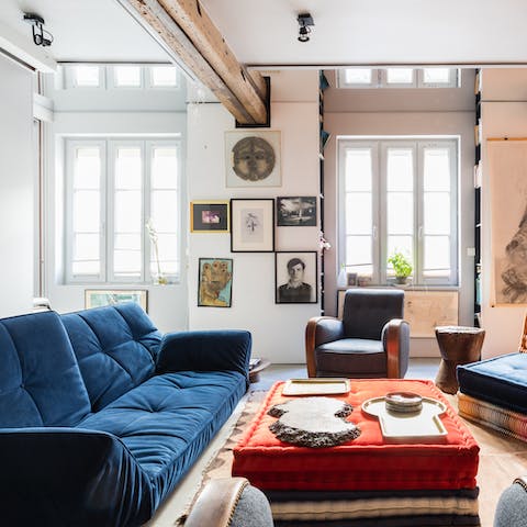Kick back in the art-filled living room with a glass of French wine