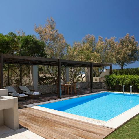 Spend warm afternoons reading on a lounger or swimming in the pool