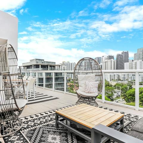 Enjoy morning coffees on the terrace overlooking Downtown Miami