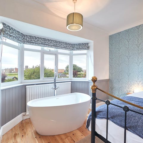 Relish the luxury of having a freestanding tub in your bedroom