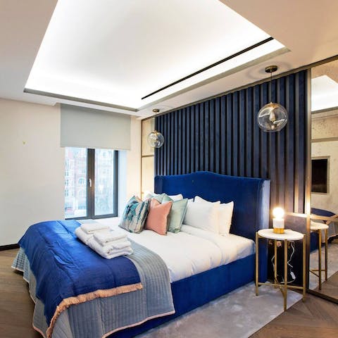 Get cosy in the immaculately designed master bedroom