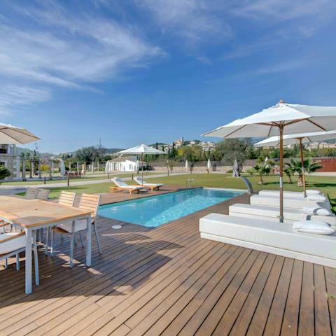 Enjoy lounging, dining and swimming on the expansive deck