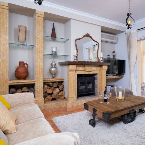Sit around the fireplace for a cosy evening in and put a movie on the big screen