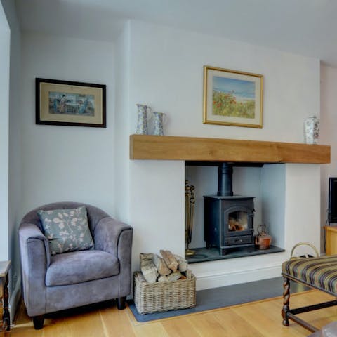 Cosy up in the comfortable sitting room in front of the wood-burning stove