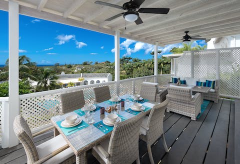 Dine alfresco with view across the resort and beyond to the sea