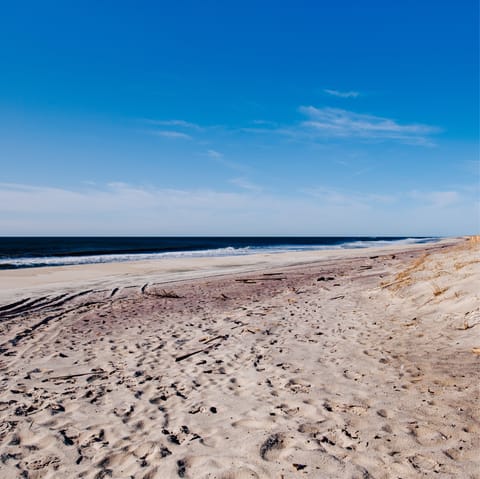 Head to the beach for a coastal stroll with the sand beneath your feet
