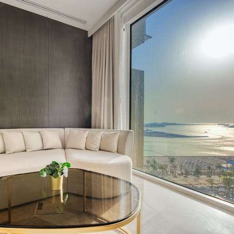 Watch the sunset over the coast from the comfort of the bedroom's sofa