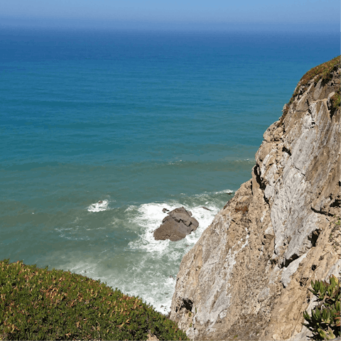 Swim in the sea at Praia da Adraga – it's a short drive away 