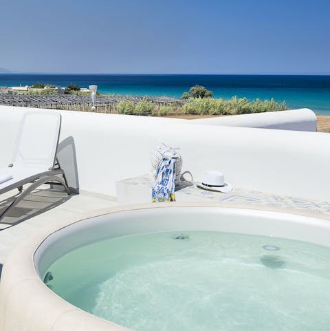 Soak up views of the Ionian Sea from the jacuzzi hot tub 