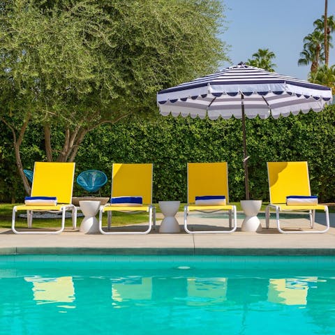 Do a few laps of your private pool and drip-dry on the colourful sun loungers
