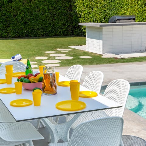 Dine poolside and serve some drinks on the terrace