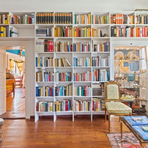 Find a book in the well-stocked library and start reading in the bright red living room