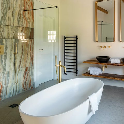 Soak in the freestanding tub in the master bedroom's Bagno bathroom