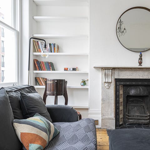 Curl up in front of the marble fireplace with a good book