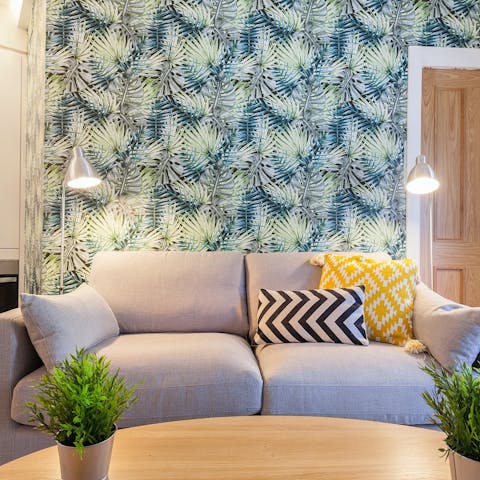 Relax on the sofa in the vibrant living room after a busy day in Madrid