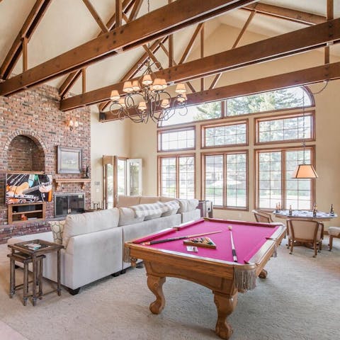 Play pool in the grand living room