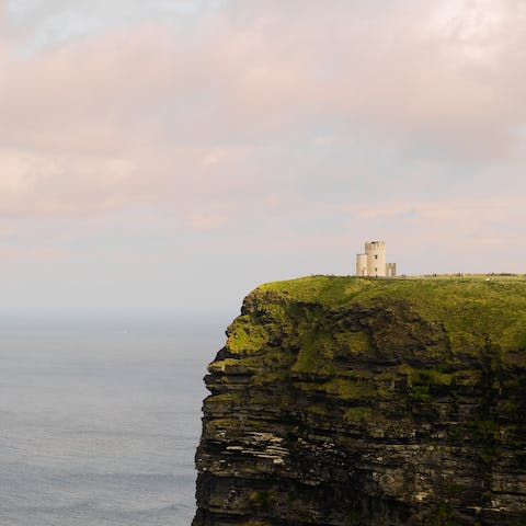 Visit the Cliffs of Moher, a forty-five-minute drive away