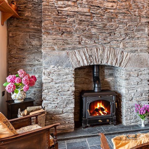 Spend cosy evenings cuddled up next to the wood-burning fireplace