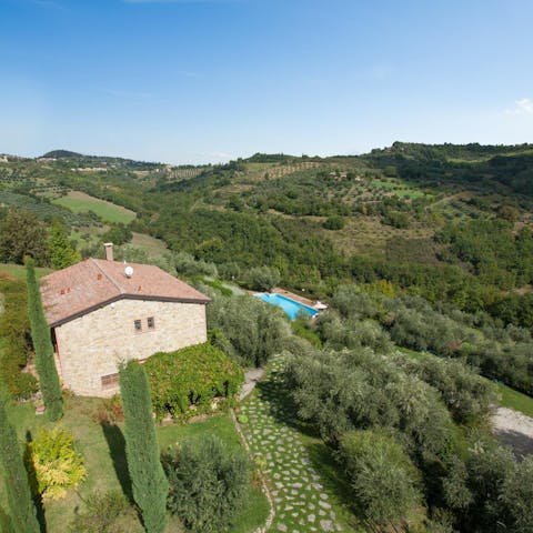 Stay in the Umbrian countryside, surrounded by olive groves and fields