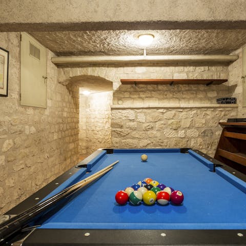 Put a friendly wager on a game of pool as you enjoy drinks