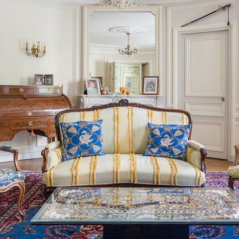 Have tea on the opulent sitting room's antique furniture