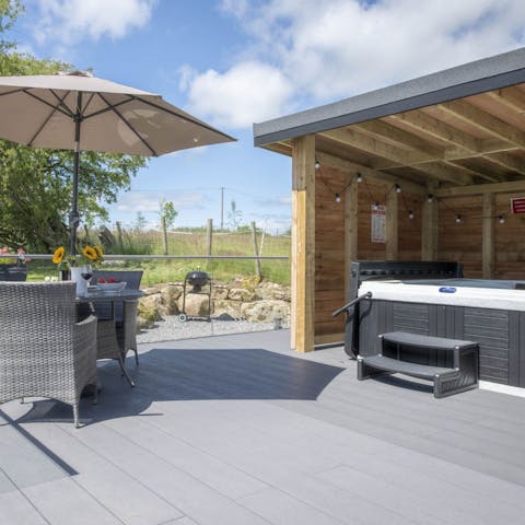 Enjoy a barbecue then relax with a glass of Champagne in the hot tub