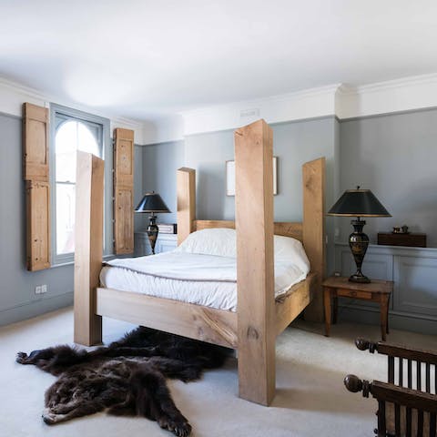 Wake up in the four poster bed