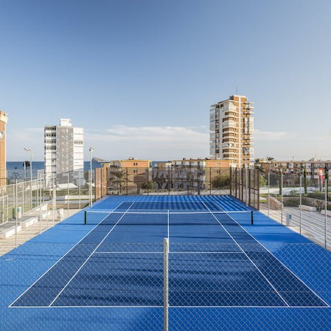 Head down to the communal tennis courts and challenge your loved ones to a few games