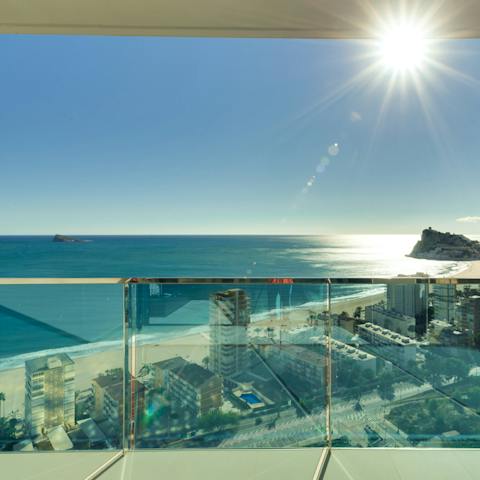 Gaze out at stunning ocean views from your roomy balcony