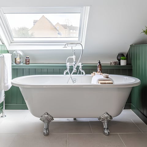 Sink into the freestanding bathtub and relax sore muscles