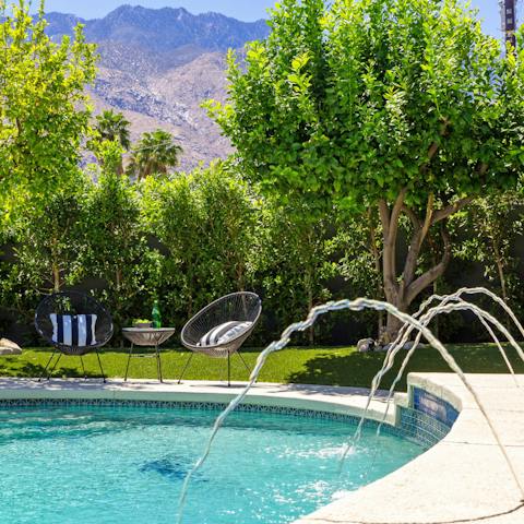 Sit by the pool with a cold drink or take a dip to enjoy the mountain scenery