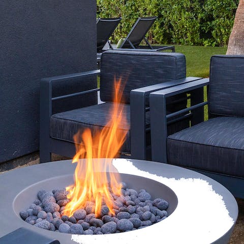 Spend cosy evenings drinking wine by the fire pit 