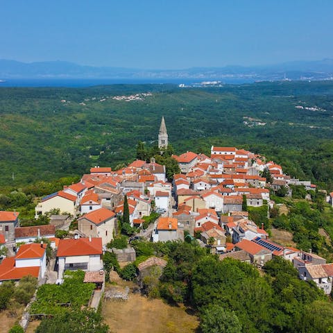 Discover Šilo's charming old town and crystal-clear coves – it's just 6km away