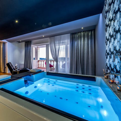 Luxuriate in the main bedroom's private jacuzzi hot tub 