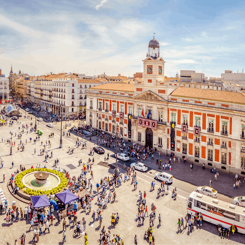 Stroll around bustling Puerta del Sol, a four-minute walk away