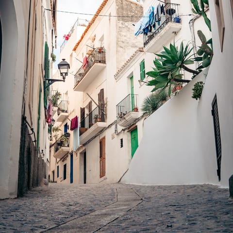Lose yourself to Ibiza Old Town's labyrinth of streets, just a ten-minute drive away