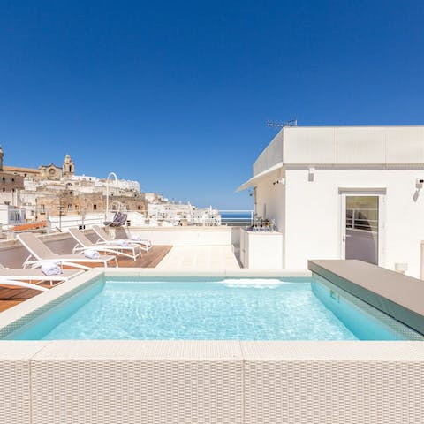 Look out over the city as you cool off in the rooftop swimming pool