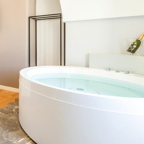 Pop the Prosecco and sink into the bedroom hot tub for a bubbly soak