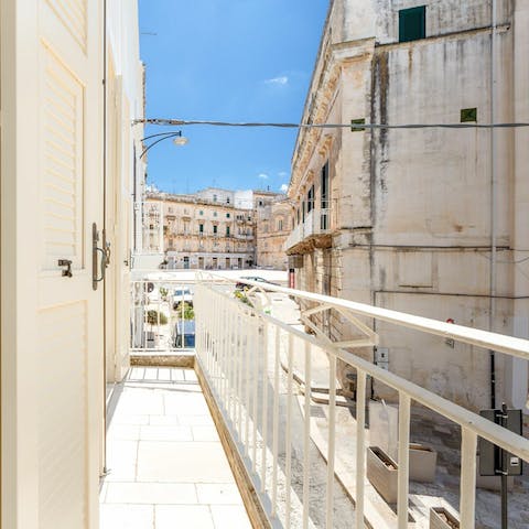 Sip your morning coffee on the balcony with a view of the surrounding streets